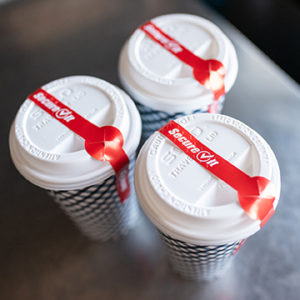 SecureIt Tamper Evident Labels on a To Go Coffee Hot Cup