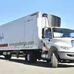 Ginsberg's Foods transportation team of cdl drivers, short haul drivers with a logistics coordinator job.