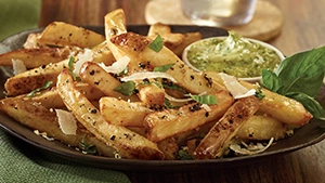 Ore Ida Steak Cut French Fries Sicilian Fry Recipe seasoned with chopped garlic, extra-virgin olive oil, Parmesan shreds, cracked black pepper and chopped basil for a classy side or snack.