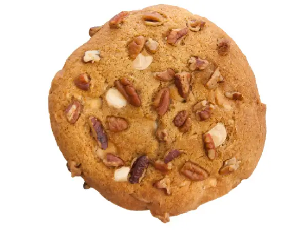 Pumpkin cookie dough loaded with white chocolate chunks, roasted pecans, and warm spices like cinnamon and nutmeg.
